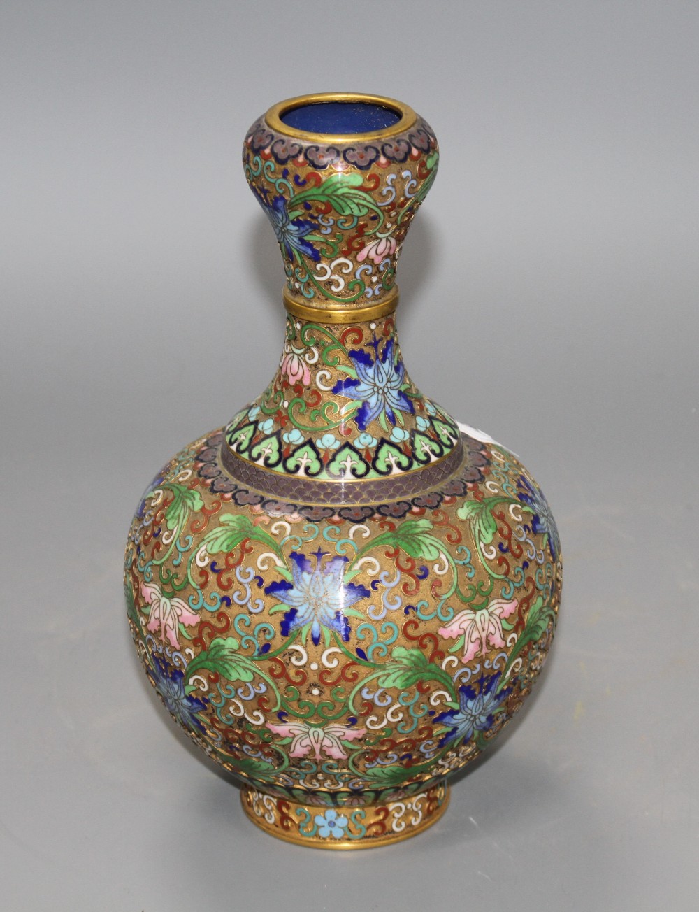 A Chinese champleve enamelled gilt brass vase, decorated with flowers, height 23cm